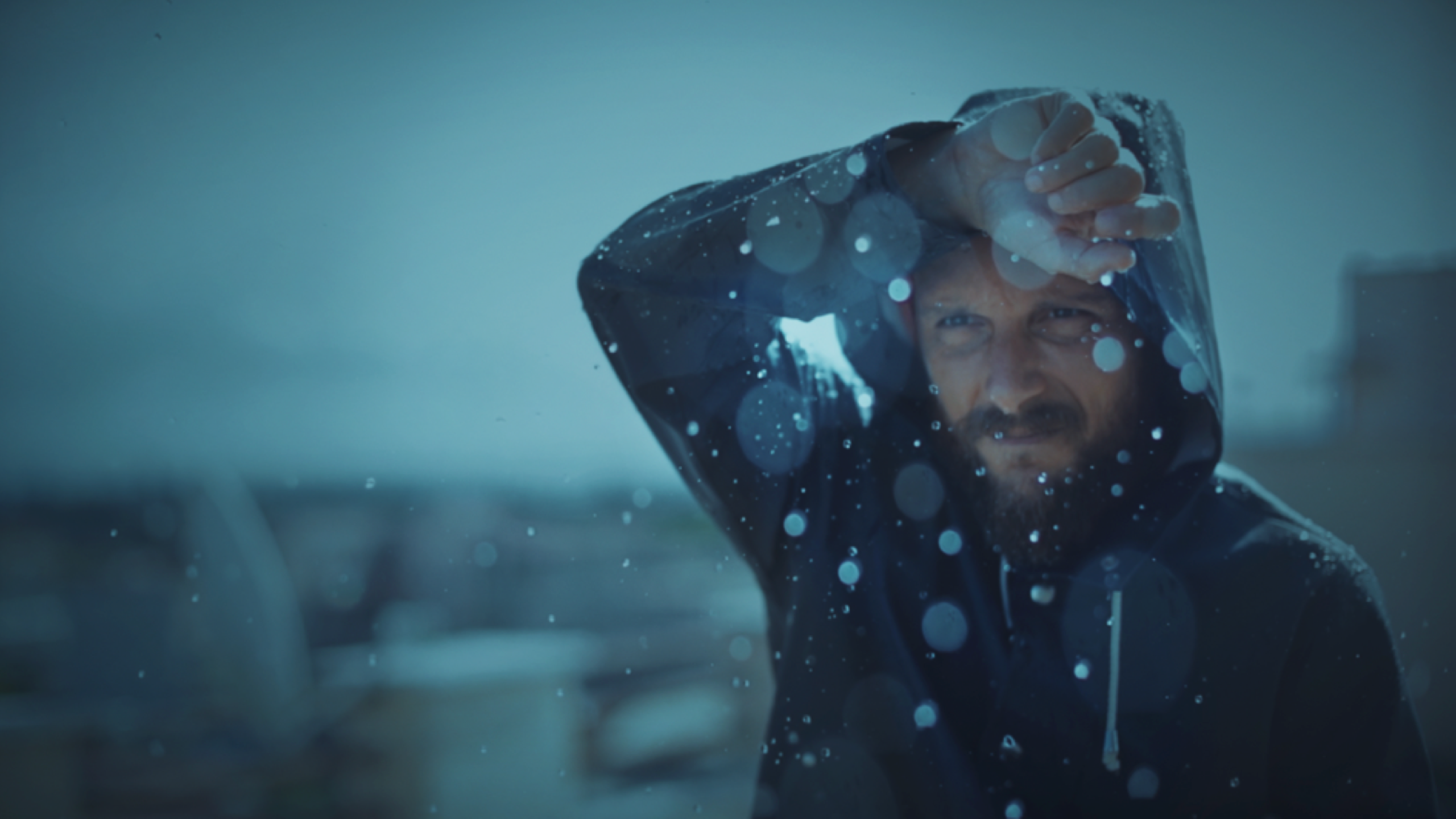 Man walking outside while it's raining